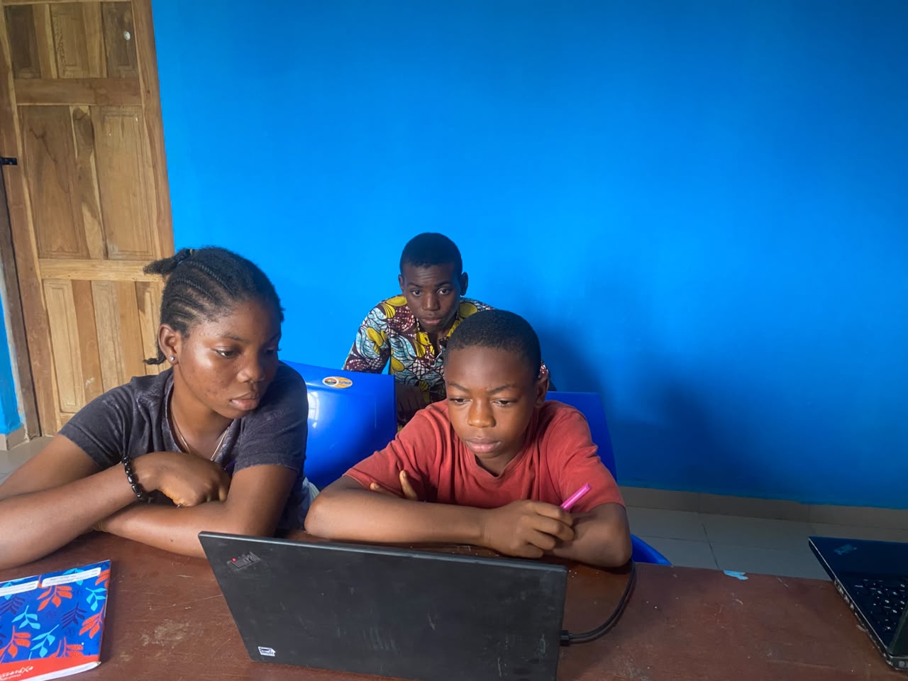 Saturday Tech Farm School students working together at laptops